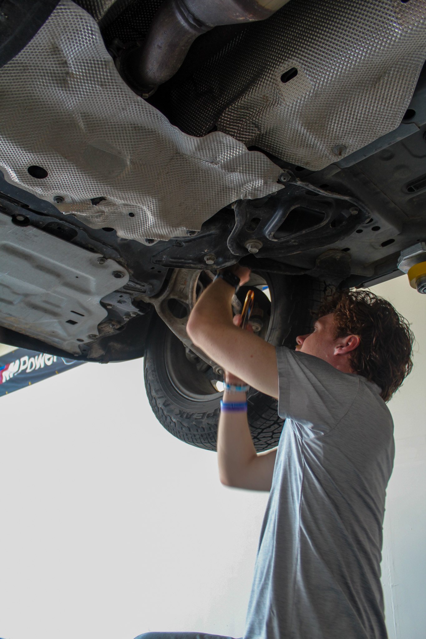 Working under a car on a lift