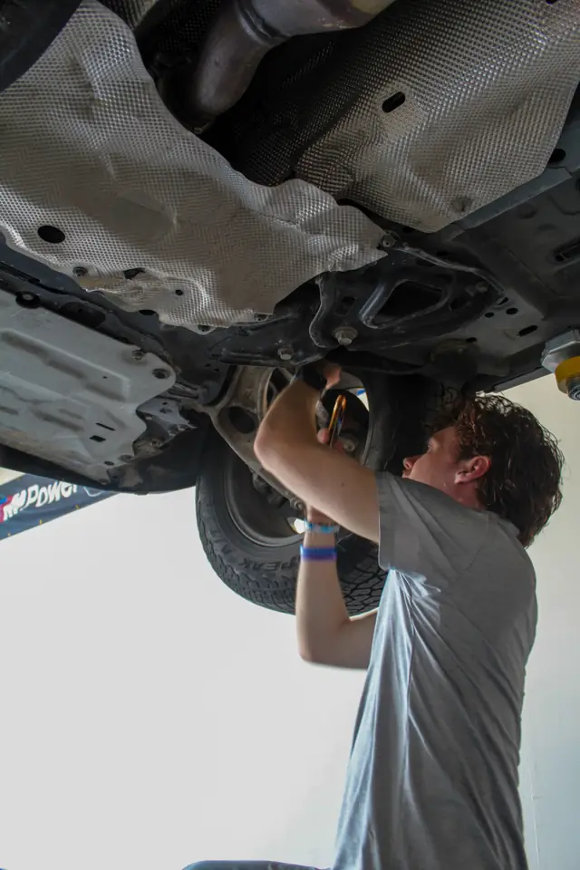 Working under a car on a lift